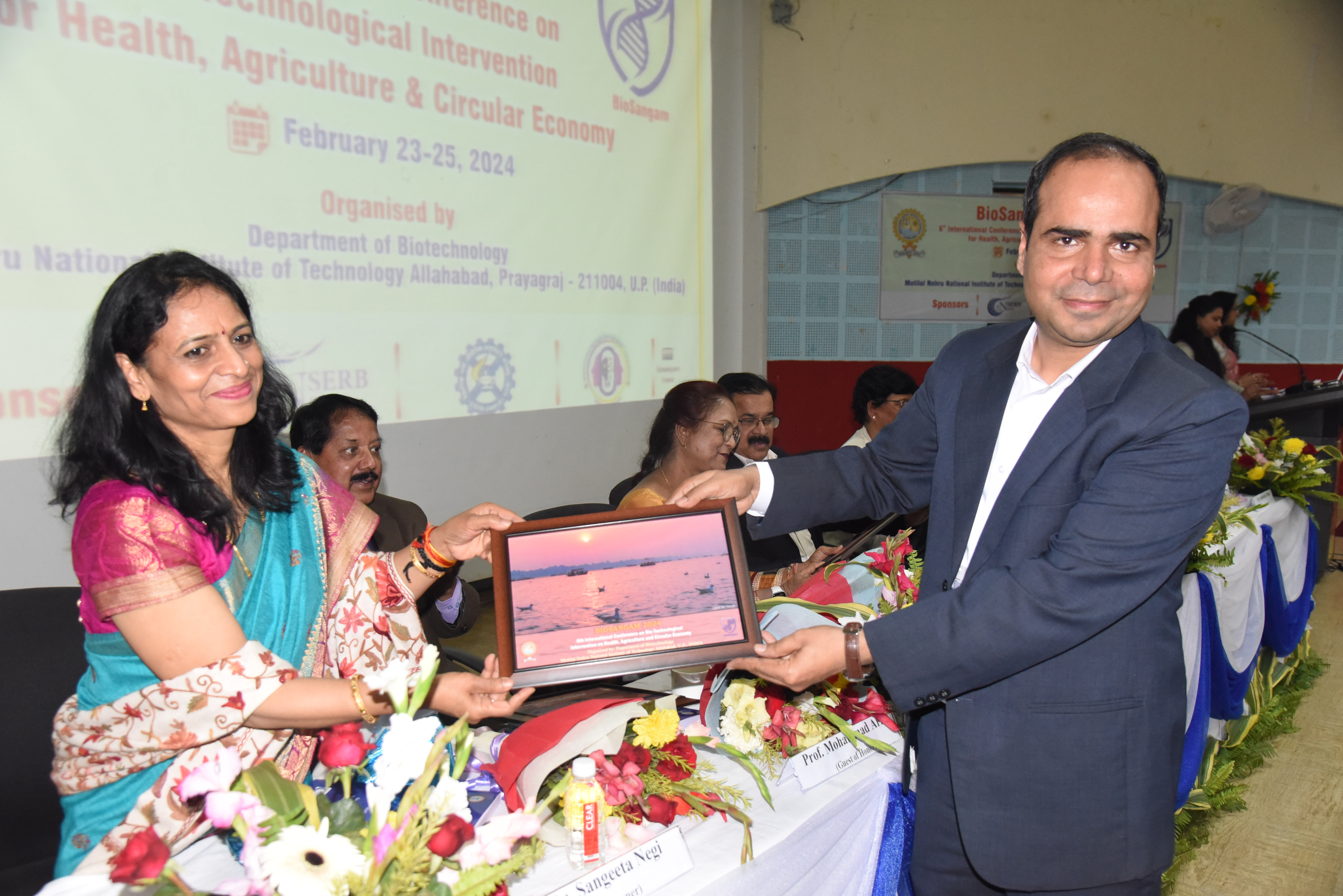 Memento presentation to a guest at the conference